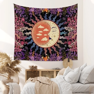Detail of sun and moon bohemian tapestry hung as a decorative bedroom backdrop