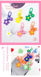 Detailed view of colorful flower charms with matching bells and lobster clasps