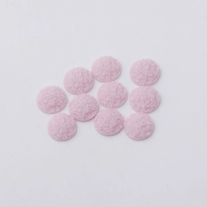 Close-up of ten 12mm pink resin crystal druzy charms with textured finish for jewelry