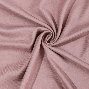 Pink rib-knit cashmere scarf for women and men featuring soft wool texture and fringe edges
