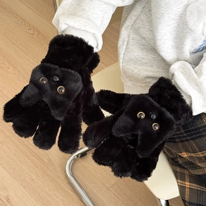 Detail of plush black cat gloves showing soft faux fur and cute 3D animal eyes