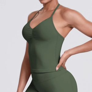 Detail of army green sports vest featuring a low V-neck and delicate spaghetti straps