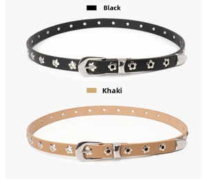 Detailed view of skinny leather belts in black and khaki with flower-shaped eyelets