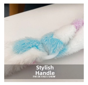 Detail of plush woven handle in blue and purple tones with a white circular ring