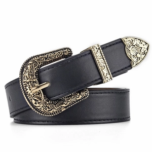 Close-up of Western style black leather belt with ornate engraved gold buckle and hardware