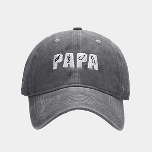 Close-up of PAPA embroidery with fishing motifs on dark grey washed cotton baseball cap
