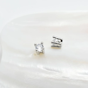 Sparkling silver zircon spacer beads for DIY jewelry making on white shell surface