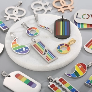 Detail view of rainbow enamel pride pendants in stainless steel with military dog tag style