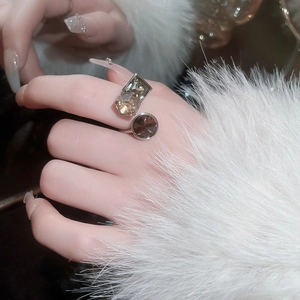 Close-up of vintage wide open ring with champagne and dark brown geometric crystals