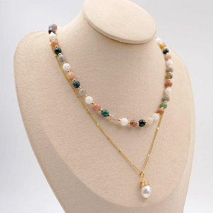 Bohemian double-layer necklace with earthy beads and a baroque pearl pendant