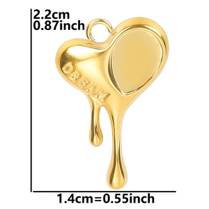Detail of golden heart pendant with DREAM engraving and unique melting fluid effect
