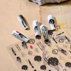 Ink style nail stickers with bamboo patterns and silver accents on nails