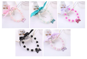 Collage of pearl pet necklaces with colorful bows and crystal bone pendants in five colors