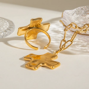 Golden stainless steel cross jewelry set with unique lava texture necklace and ring