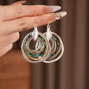 Ethnic bohemian layered hoop earrings with turquoise accents and silver leaf detail