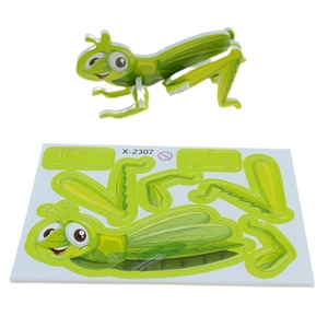 Detail view of 3D green mantis paper puzzle showing assembly board and finished toy model