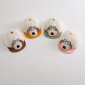 Detail of four colorful corduroy baby baseball caps with cute 3D cartoon dog embroidery