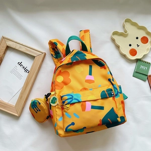Cute yellow children's backpack with colorful floral prints and matching coin purse