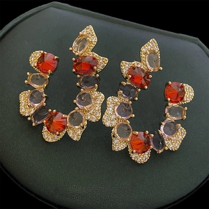 Vintage gold C-shaped drop earrings with colorful zircon stones in a royal court style