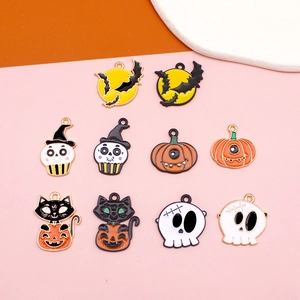 Detailed close-up of Halloween alloy charms featuring moon bat and pumpkin motifs