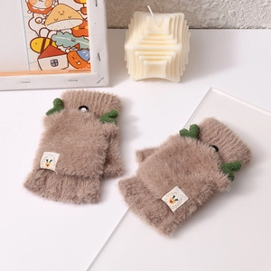 Close-up of warm brown plush flip-top gloves with cute green reindeer antler decorations