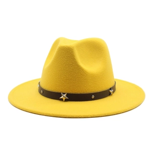 Detail of yellow wool fedora hat with black star studded band and silver rivets