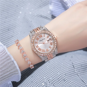 Two-tone women's watch and heart bracelet set with crystal accents and date window