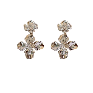 Elegant layered flower earrings with textured silver petals in a vintage metallic style
