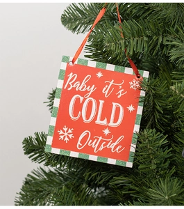 Detail of square Christmas ornament with Baby it's COLD Outside text on tree