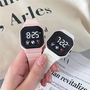 Close-up of stylish digital sports watches with astronaut icons and silicone straps
