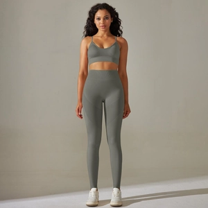Front view of seamless ribbed yoga set featuring V-neck sports bra and high-waist leggings