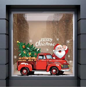 Detail of red Christmas truck window sticker with Santa Claus and snowflakes on glass
