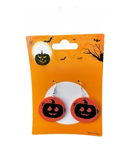 Detail view of round Halloween pumpkin earrings on a festive orange display card