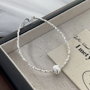 Elegant S925 sterling silver beaded bracelet with matte cat eye stone on linen tray