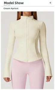 Detail of slim-fit polar fleece jacket in creamy apricot with soft stand collar