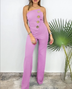 Close-up of lavender tube jumpsuit featuring elegant gold button accents on the side