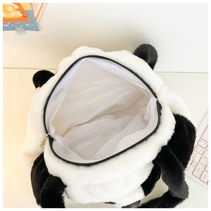 Detail view of large plush panda bag showing white mesh lining and black zipper closure