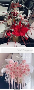Festive Christmas poinsettia arrangement and pink rose bouquet with glitter decorations