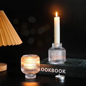 Modern ribbed glass candle holder with elegant vertical stripes for home decor