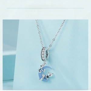 Detail of S925 sterling silver moon cat pendant with glowing stone and micro-inlay
