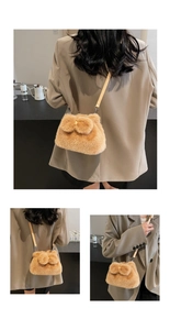 Detail of khaki plush bucket bag featuring a soft bow and slender leather strap