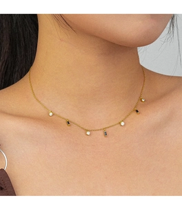 Detail of S925 silver gold chain necklace with black rectangle and clear round zircon