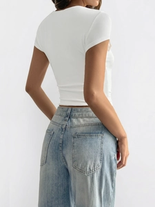 Slim fit white short sleeve T-shirt for women shown from back view with blue jeans