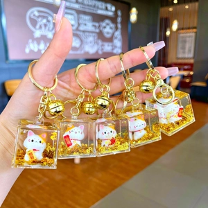 Set of five cute fortune cat keychains with liquid gold foil and lucky charms