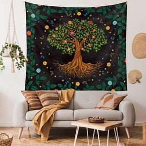 Detailed view of Tree of Life tapestry hanging in a cozy living room over a sofa