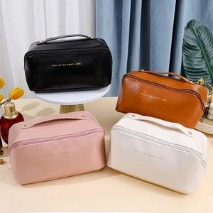 Detailed comparison of leather cosmetic cases in black, brown, pink, and white colors