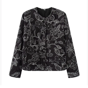 Quilted black women jacket with white floral pattern and crew neck in a flat lay view