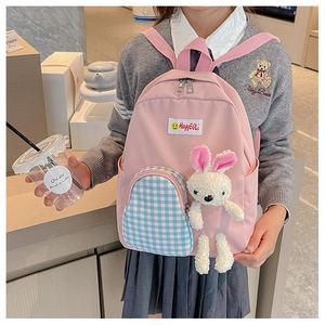 Pink children backpack with blue plaid pocket and cute plush bunny doll attachment