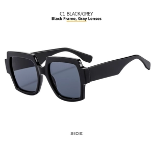 Side profile of black square frame sunglasses with wide temples and grey lenses