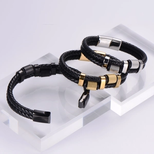 Detailed view of 18K gold plated double-layer braided leather bracelets in black and gold